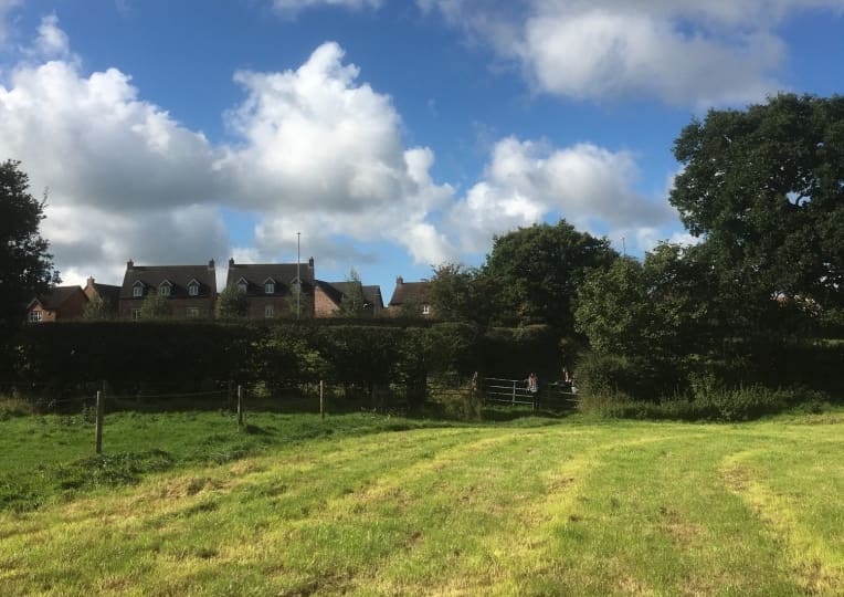 Housing at edge of town, beside fields