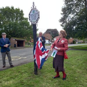 The Lord-Lieutenant of Wiltshire, Mrs Sarah Troughton, unveils the Best Kept Large Village standard at Bratton