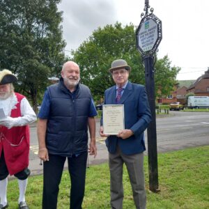 Ken McCall of CPRE West Wiltshire (L) presents the Best Kept Large Village in West Wiltshire certificate to Keith Rayward, Chairman of Bratton Parish Council