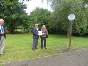 Anne Henshaw, Chairman of CPRE Wiltshire, presents the Best Kept Small Village in North Wiltshire certificate to Bob Lunn, Clerk of Urchfont Parish Council