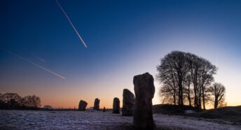 Shooting star over Avebury stones at dawn