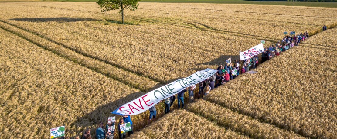 Aerial view of protestors at the proposed solar farm site at One Tree Hill, Potterne